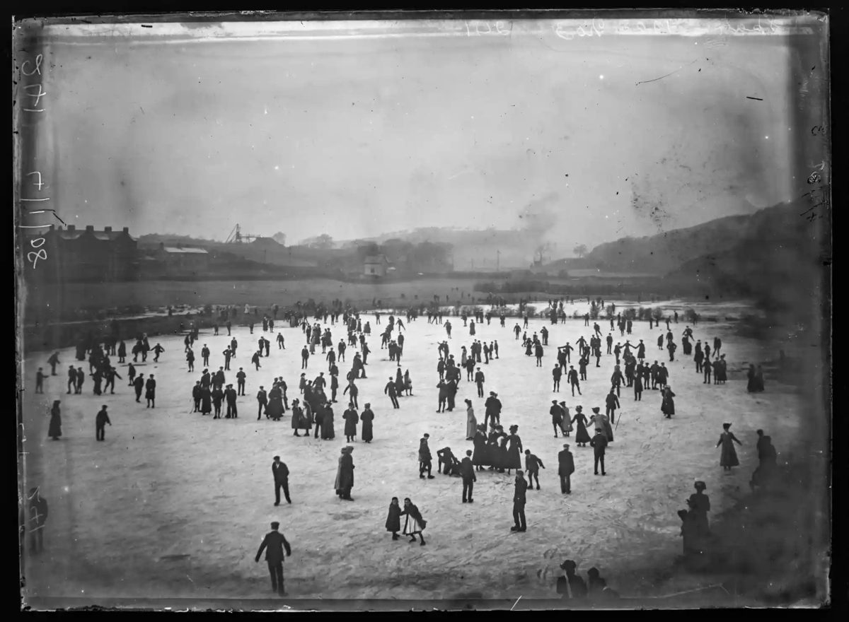 Crowds skating on the ice at Thwaite Flat, Dalton-in-Furness, 1908