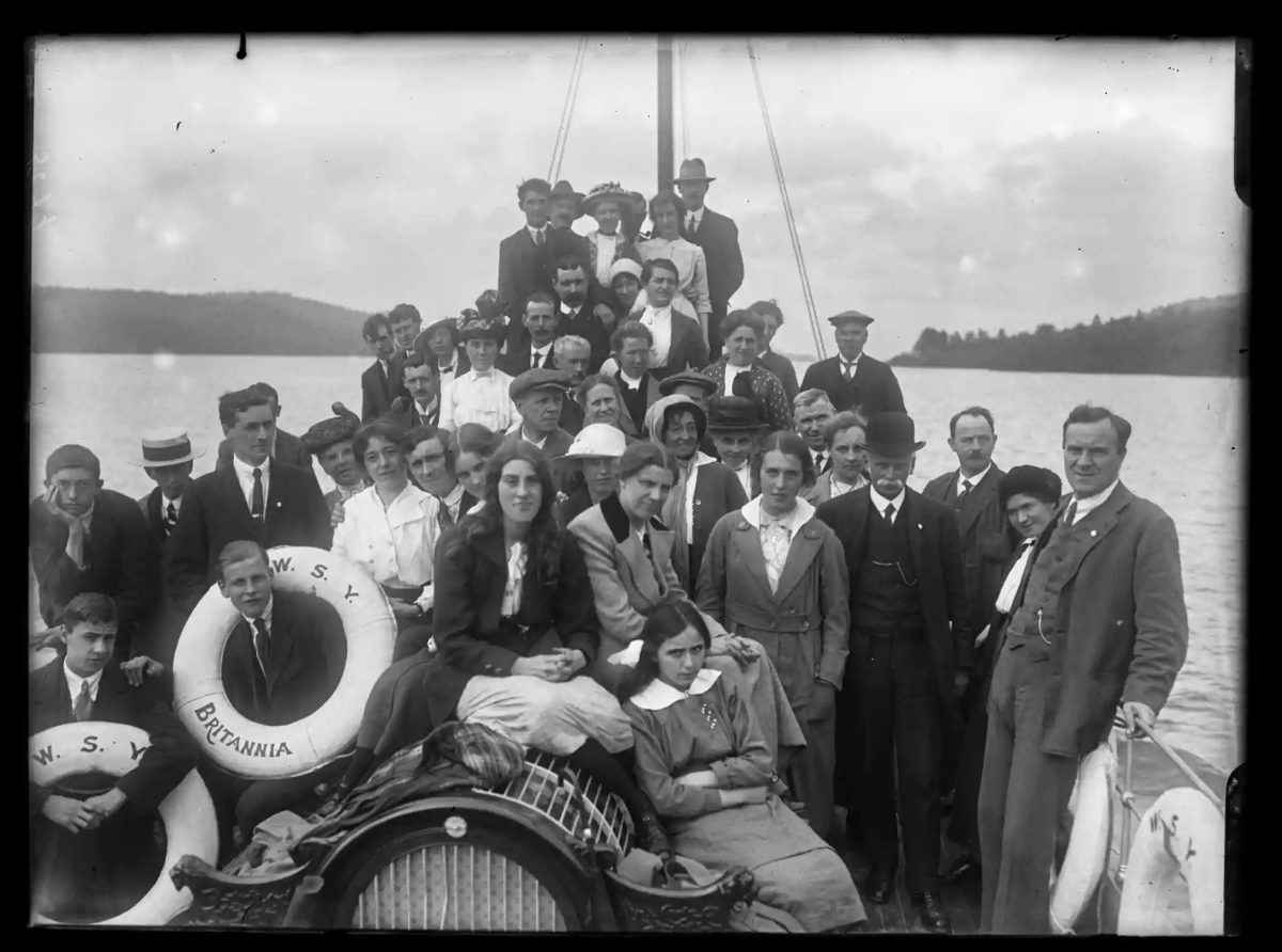 People cram into the stern of the steam yacht Britannia on Windermere