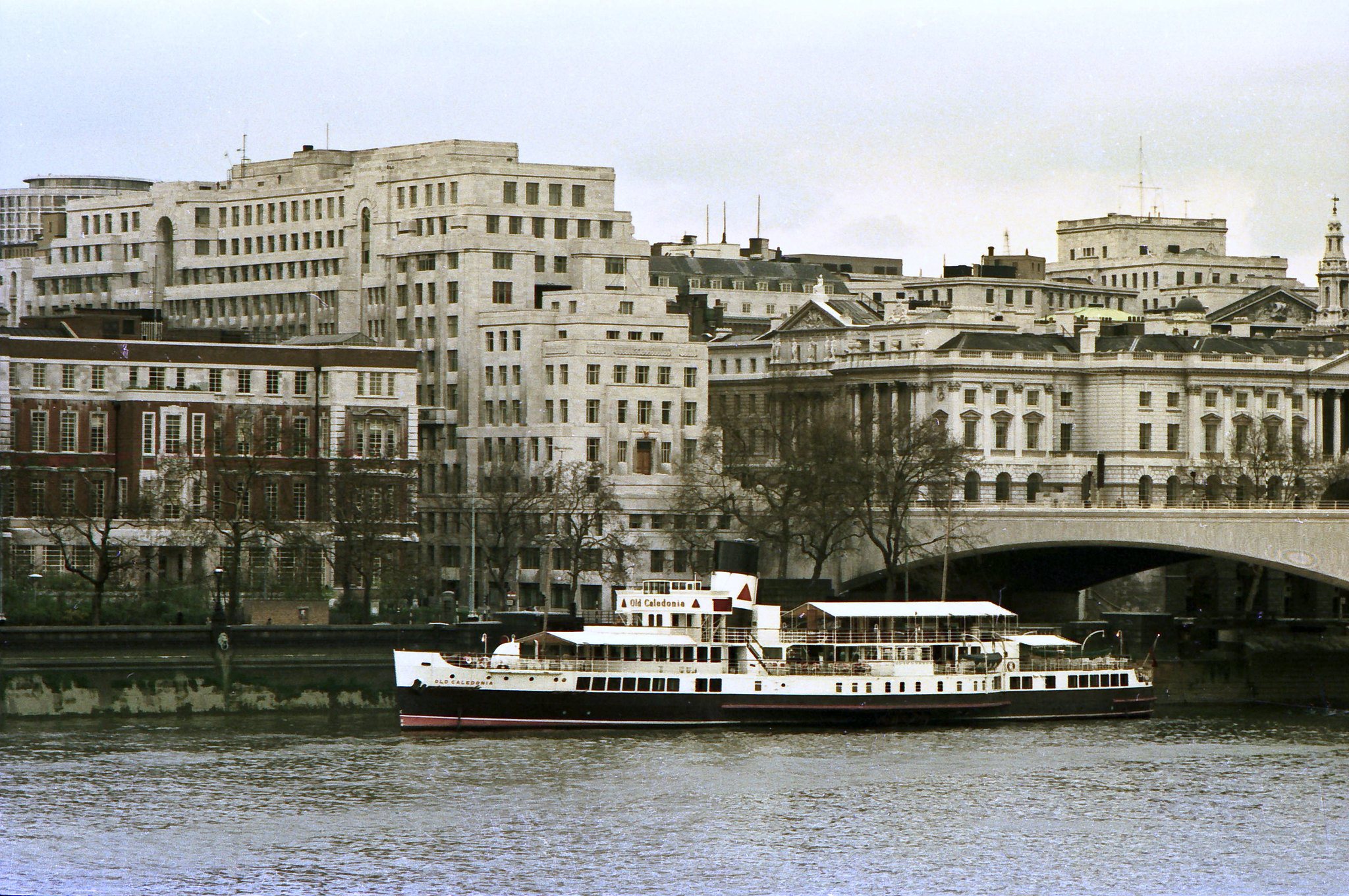 Paddle steamer, Old Caledonia moored by the Thames Embankment adjacent to Waterloo bridge. 19th April 1975.