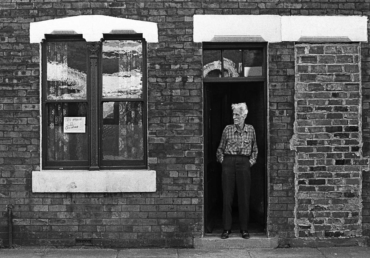 'Mr Turner' in his doorway in Ordsall, Salford, 1977 (Image- Phil Portus)