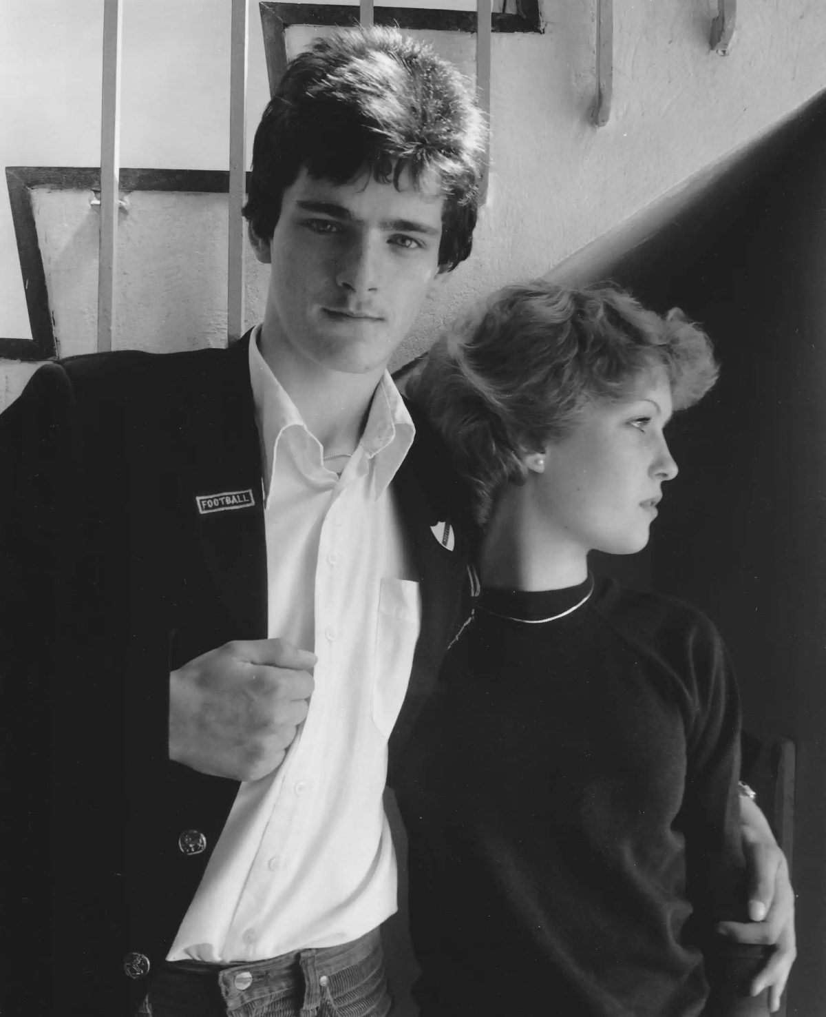 A young couple standing at the foot of the art room stairs, East Cleveland, 1982