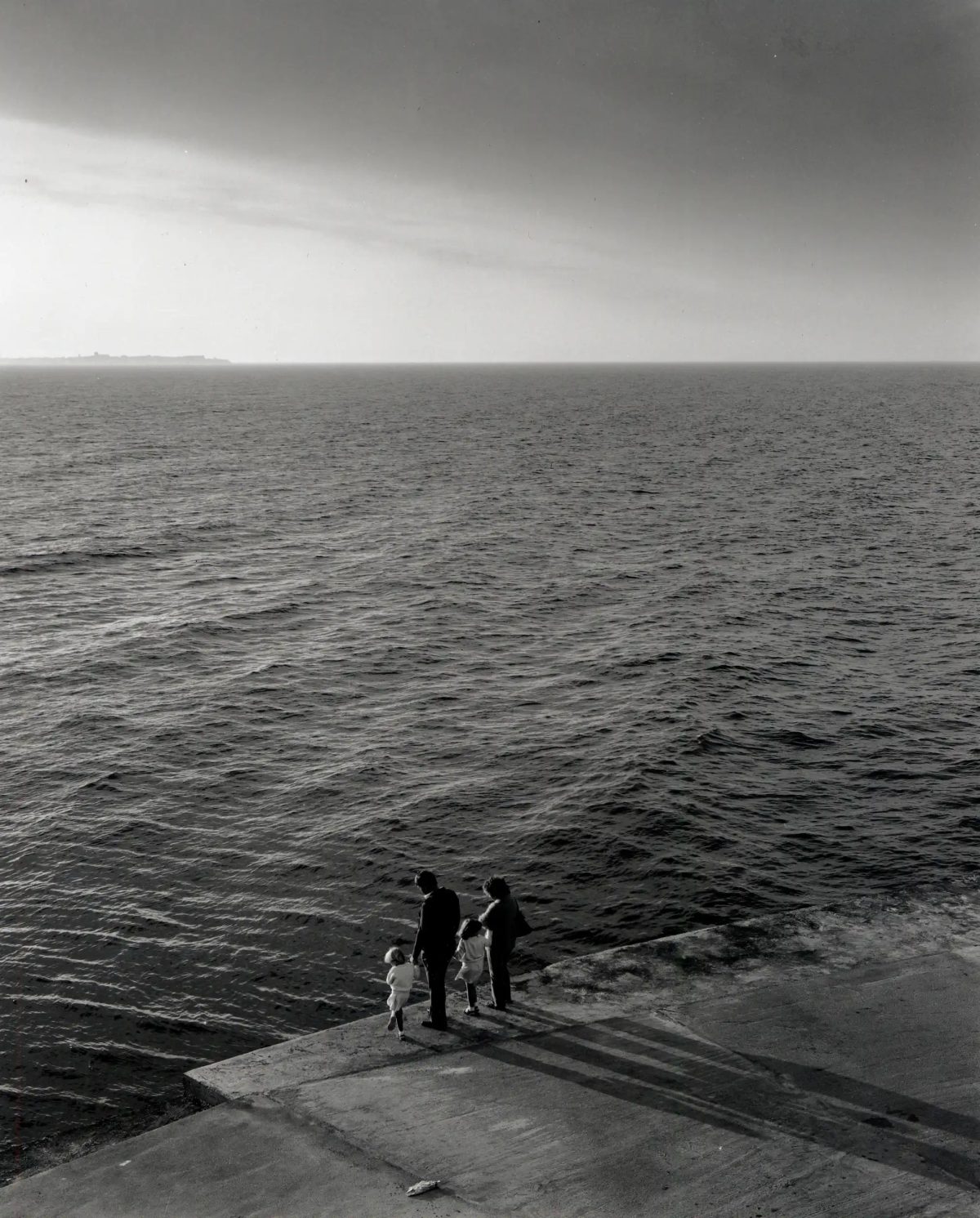 Family on the edge of South Gare, Teesmouth, 1980