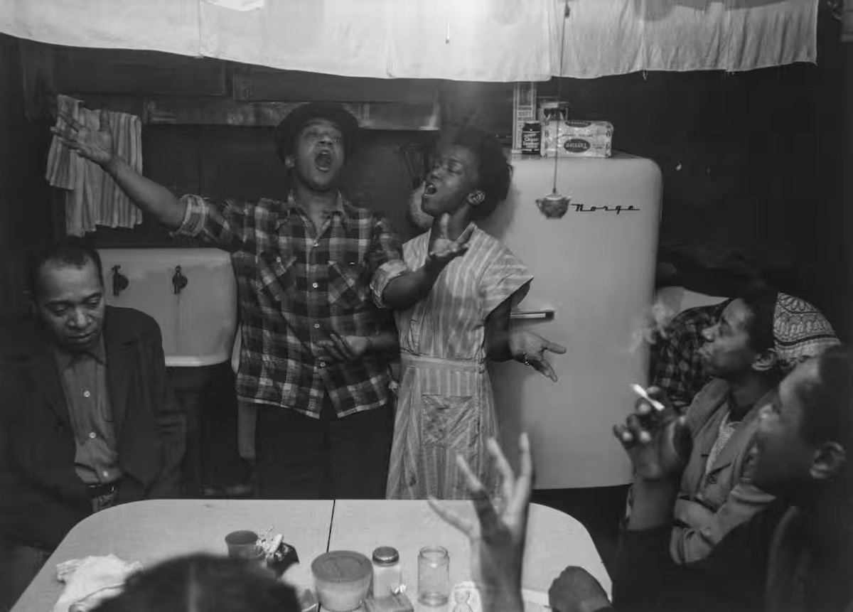 Joe and Julia singing, 1953, from The Sweet Flypaper of Life. Photograph- © The Estate of Roy DeCarava ​2018. All rights reserved. Courtesy David Zwirner