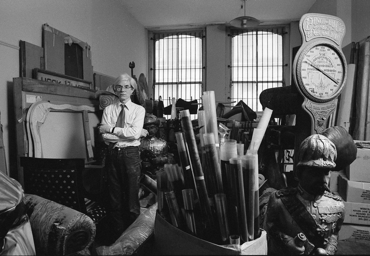 Andy Warhol in a storage room at the Factory (1981)