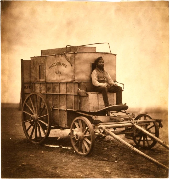 Roger Fenton (British, 1819-1869)The artist’s van [Marcus Sparling, full-length portrait, seated on Roger Fenton’s photographic van] 1855 Salted paper print 17.5 × 16.5cm Library of Congress, Prints & Photographs Division