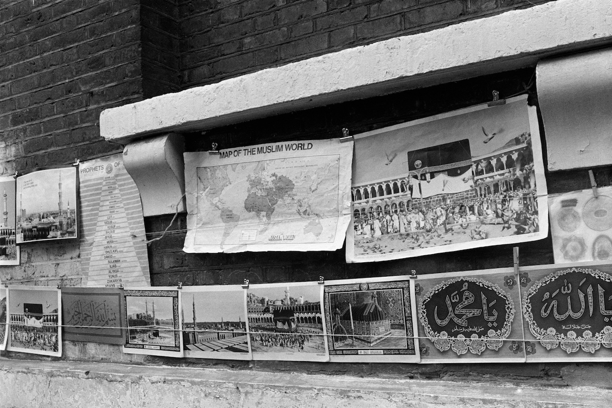 Posters, Brick Lane, Spitalfields, Tower Hamlets, 1989 I think these were for sale, hanging on the wall of the Mosque.