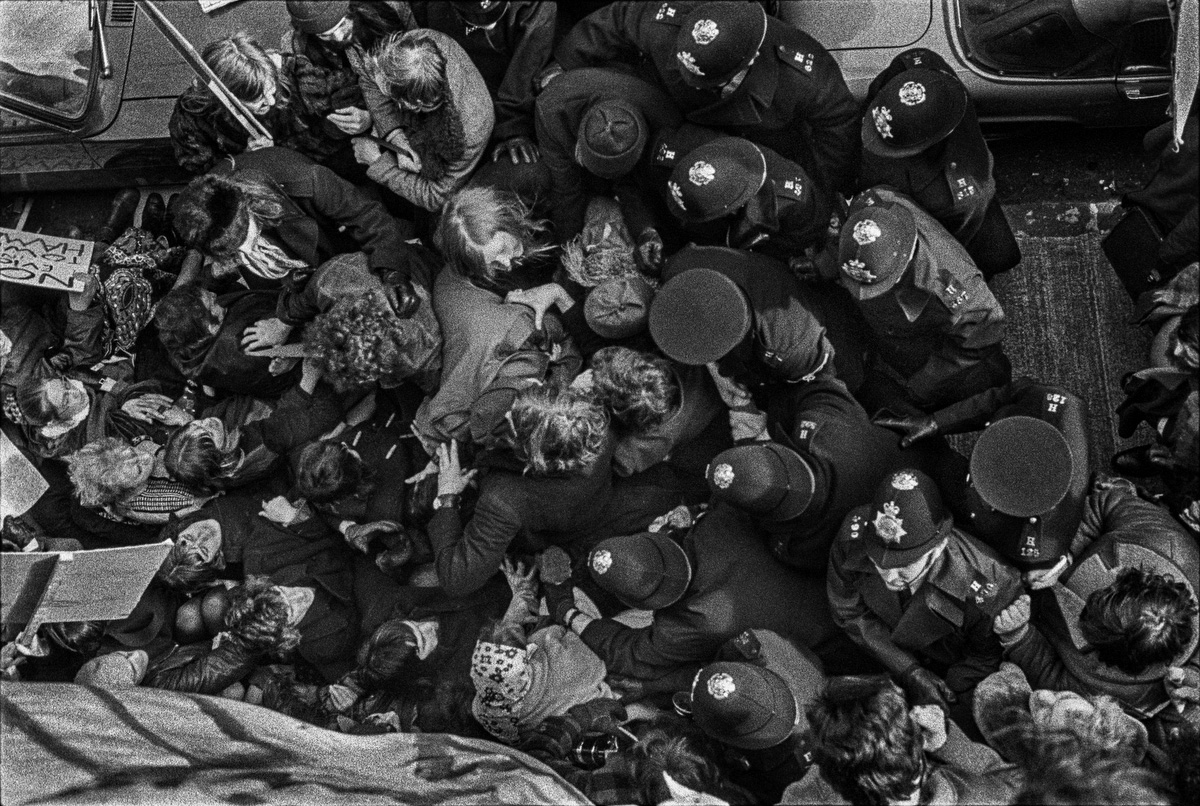 Police try (and fail) to force a path through squatters and their supporters preventing the eviction of squatters from private rented property that was being kept empty in Parfett Street, Whitechapel, London. 1973.