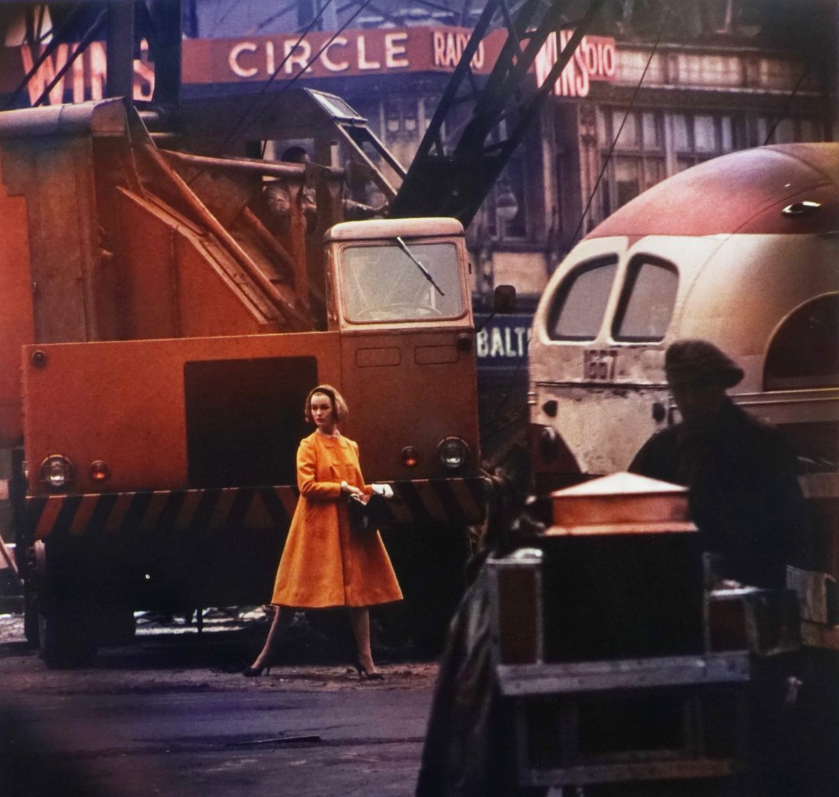 William Klein1926-2022 Yellow Coat + Bus + Crane, New York, 1958