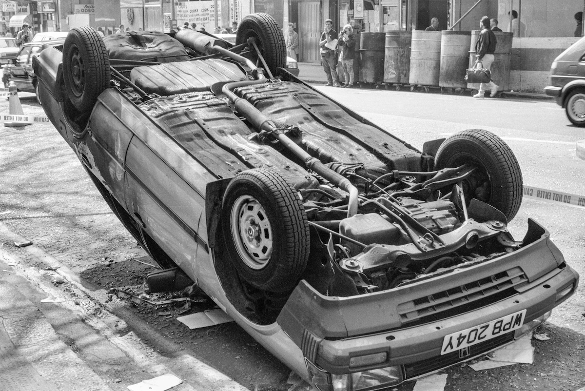 Smashed car, Charing Cross Rd, Westminster, 1990
