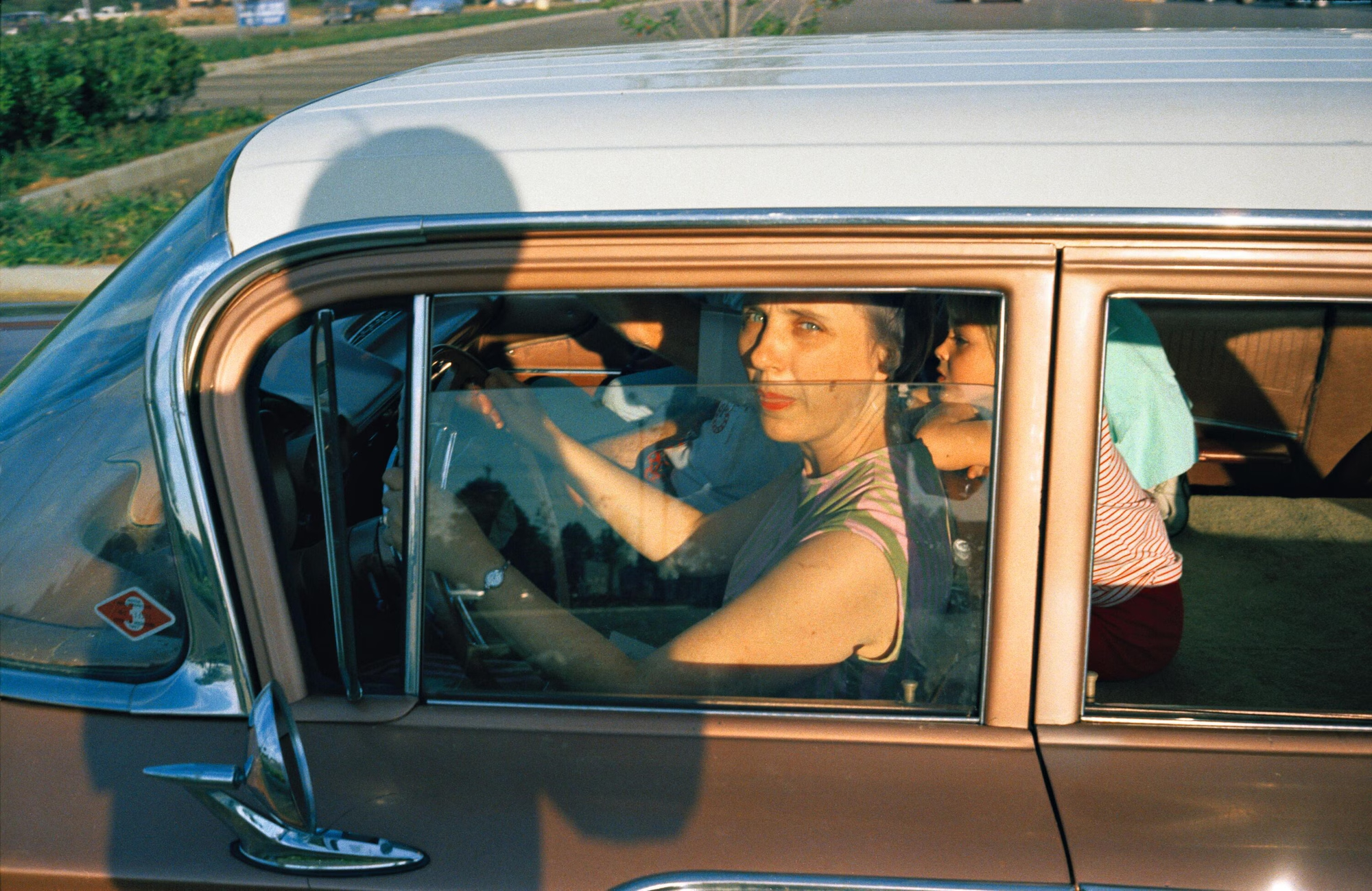 Untitled, (Woman and Children in Car) from the series Dust Bells, c 1970-74